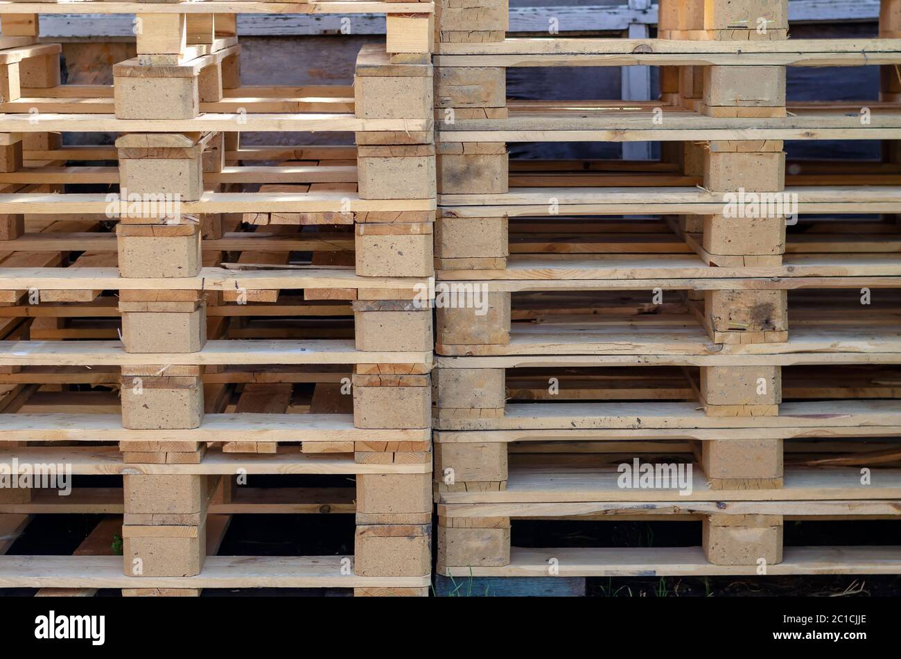 Empty wooden pallets outdoors. A stack of pallets for easy