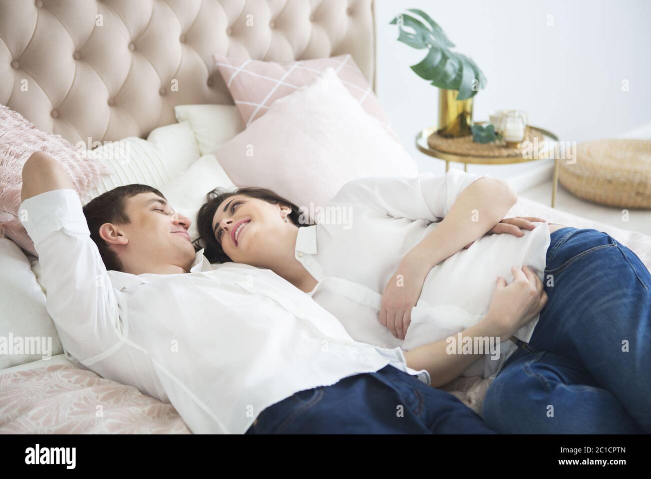 Portrait of the pregnant woman and young man together Stock Photo - Alamy