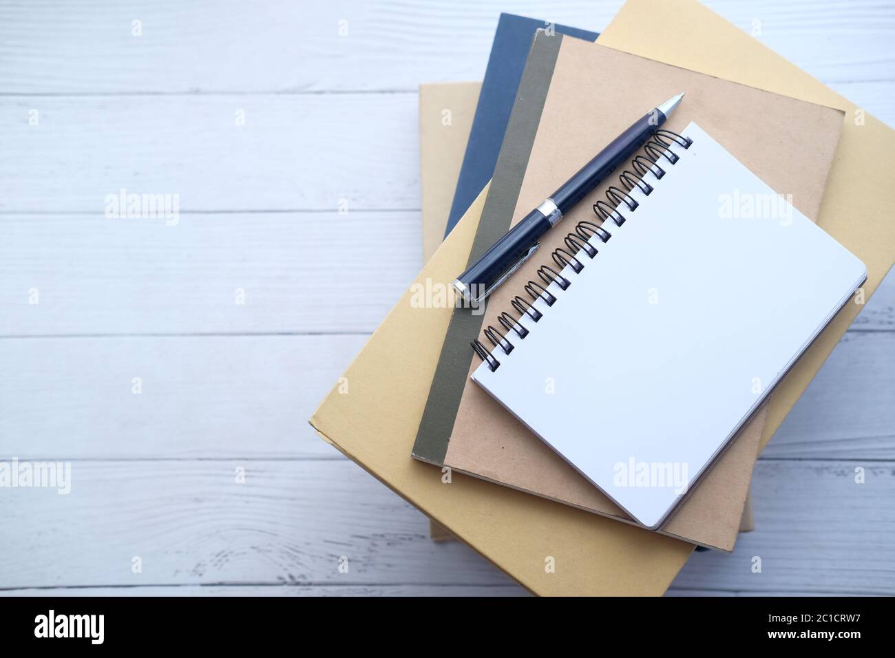 Open Notepad Book high angle view of open notepad on stack of books Stock Photo - Alamy