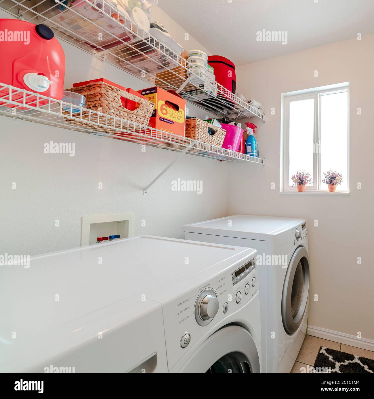 Square frame Laundry room in house with electrical appliances Stock