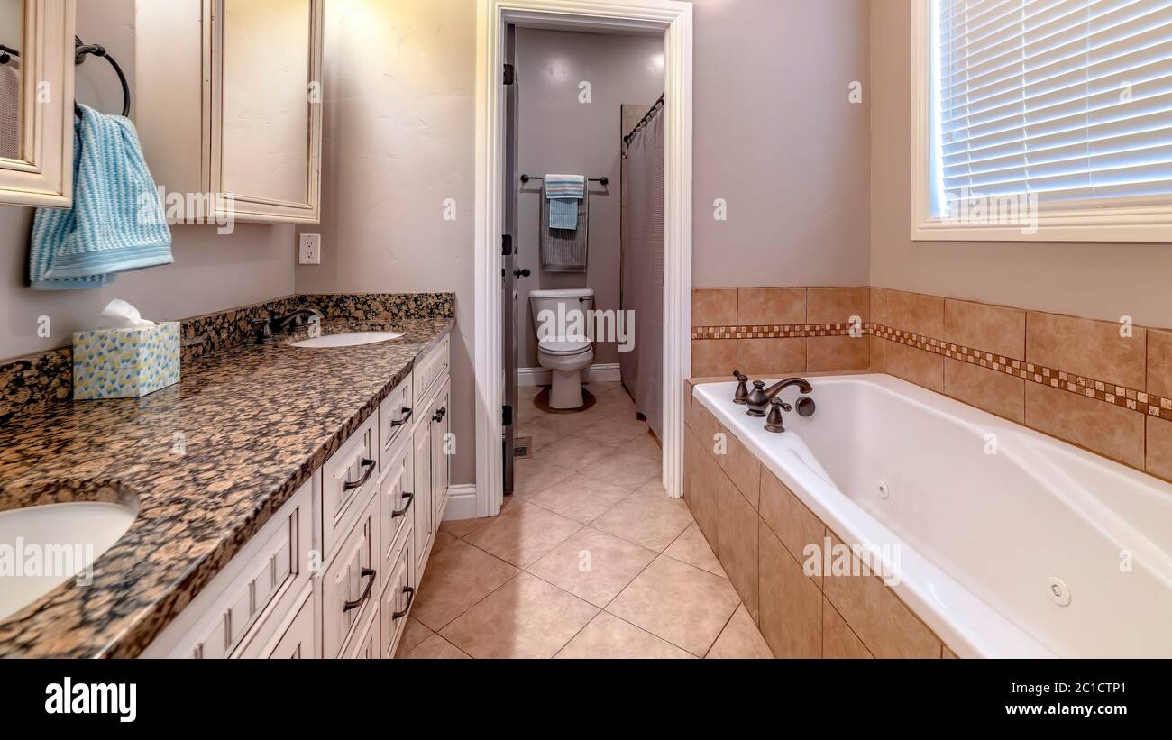 pics Bathroom Mirror Cabinets For Double Sinks https www alamy com panorama bathroom interior with bathtub double sink vanity mirror cabinets and window image362315241 html