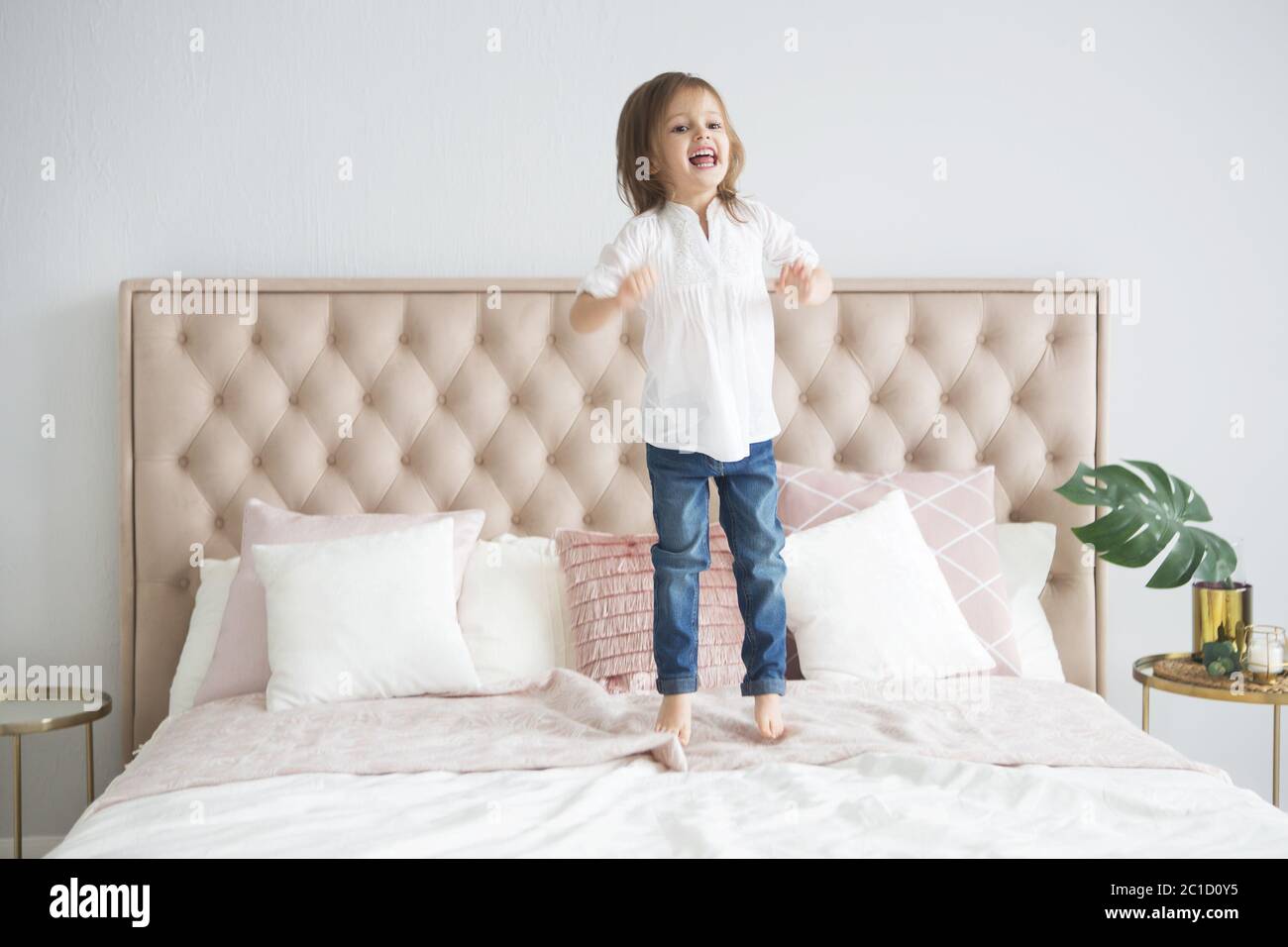 Portrait of the happy little cute girl a on white background Stock ...