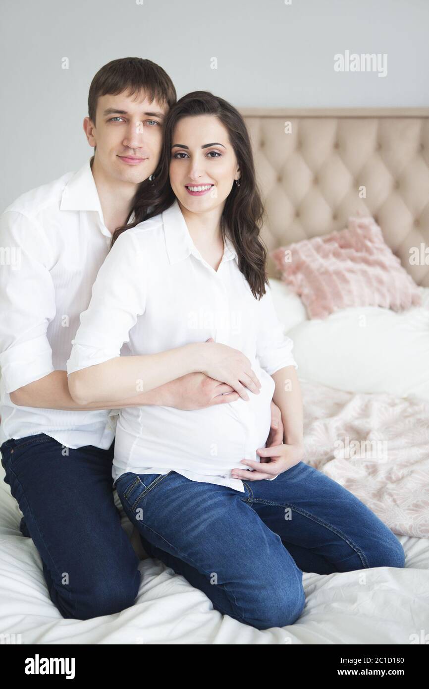 Portrait of the pregnant woman and young man together Stock Photo - Alamy