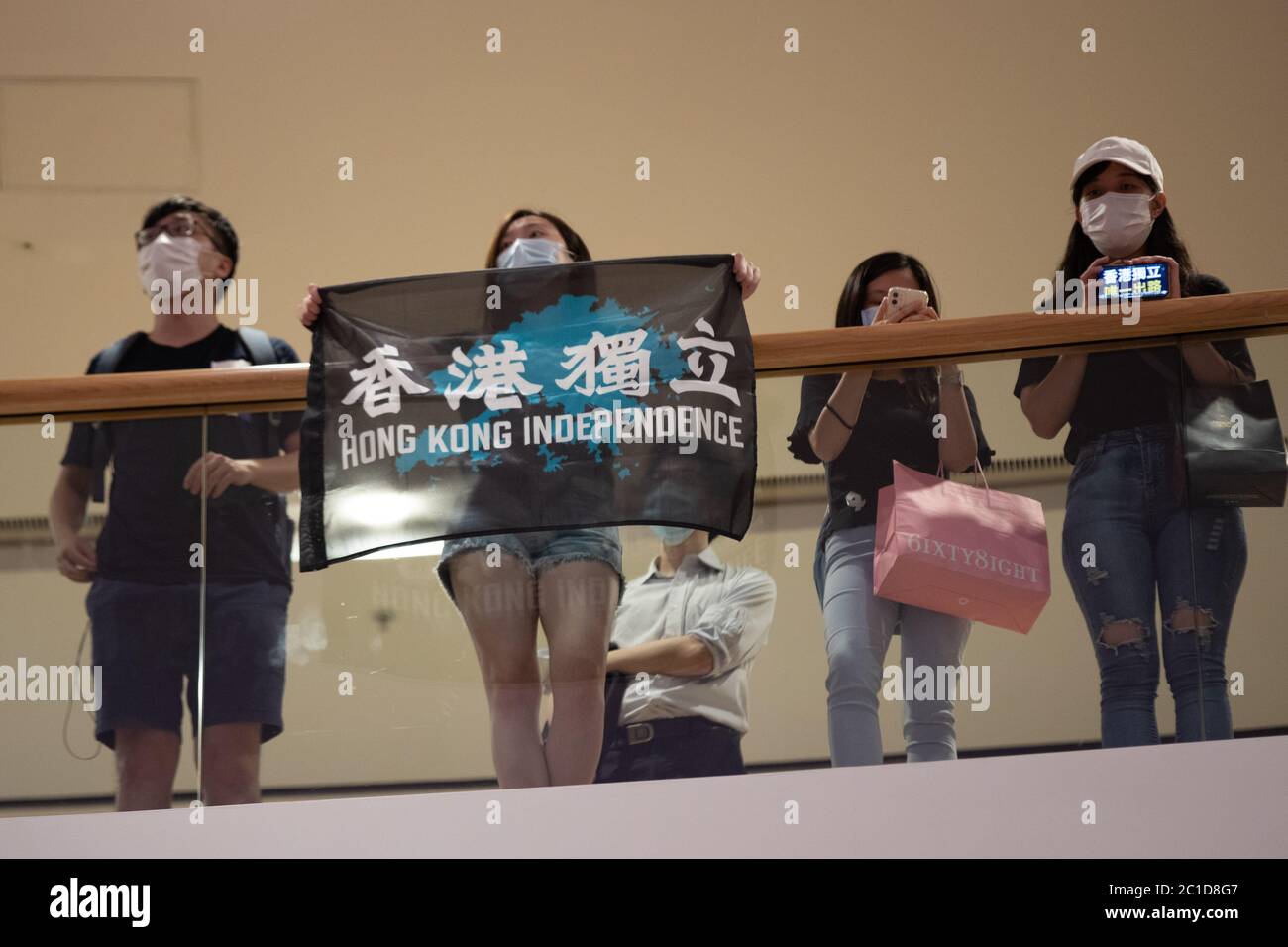 Hong Kong, Hong Kong. 15th June, 2020. Pro Democracy supporters hold Hong Kong Independence signs and chant slogans such as 'One Nation, One Hong Kong' as members of the public queue for hours to pay respects to Marco Leung Ling-kit in Hong Kong Hong Kong, S.A.R., June 06, 2020. Marco Leung Ling-kit fell to his death on, June 15, 2019. (Photo by Simon Jankowski/Sipa USA) Credit: Sipa USA/Alamy Live News Stock Photo