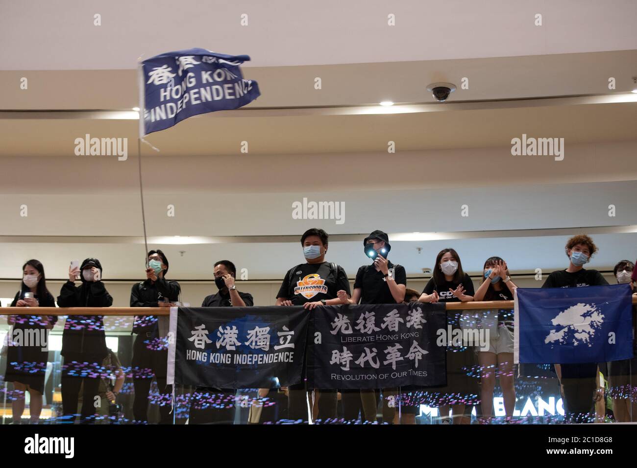 Hong Kong, Hong Kong. 15th June, 2020. Pro Democracy supporters hold Hong Kong Independence signs and chant slogans such as 'One Nation, One Hong Kong' as members of the public queue for hours to pay respects to Marco Leung Ling-kit in Hong Kong Hong Kong, S.A.R., June 06, 2020. Marco Leung Ling-kit fell to his death on, June 15, 2019. (Photo by Simon Jankowski/Sipa USA) Credit: Sipa USA/Alamy Live News Stock Photo
