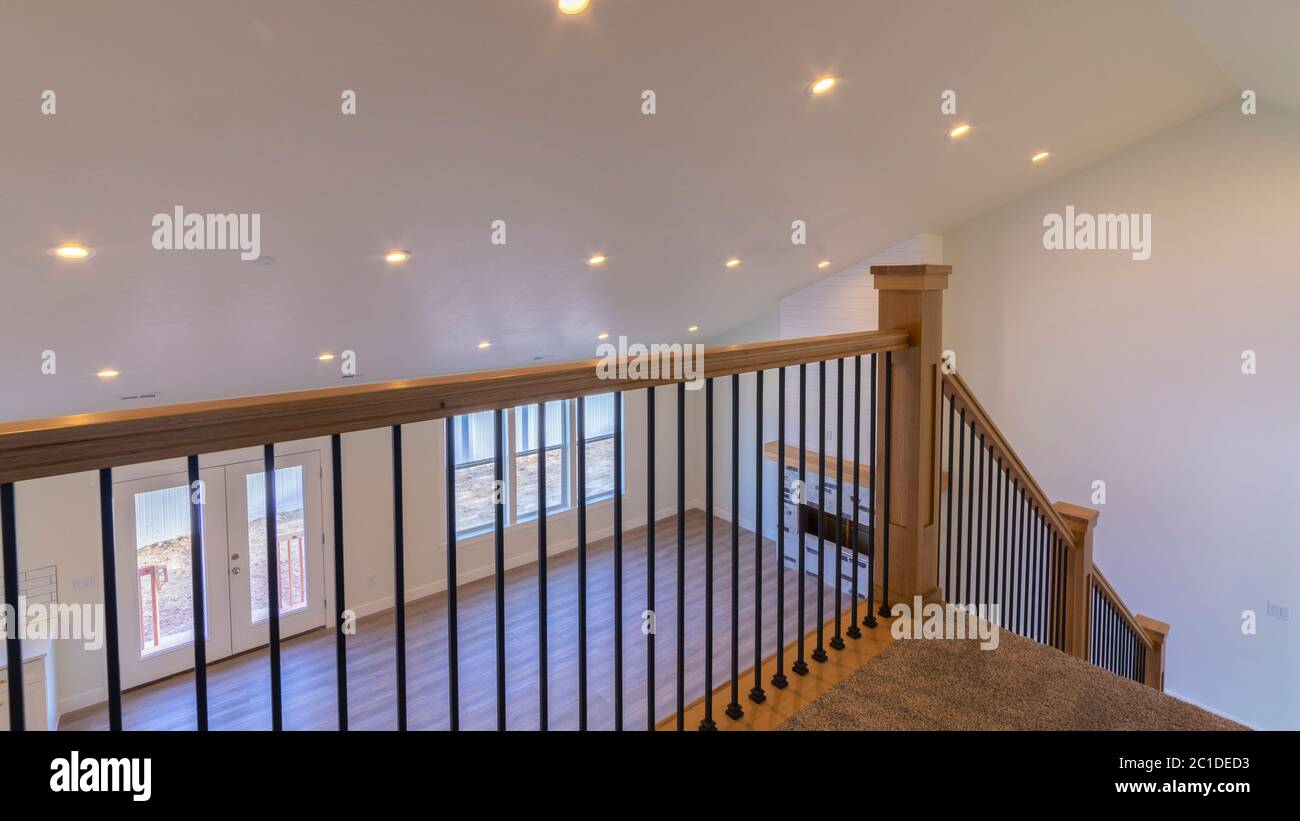 Panorama crop View through the banisters of a staircase Stock Photo