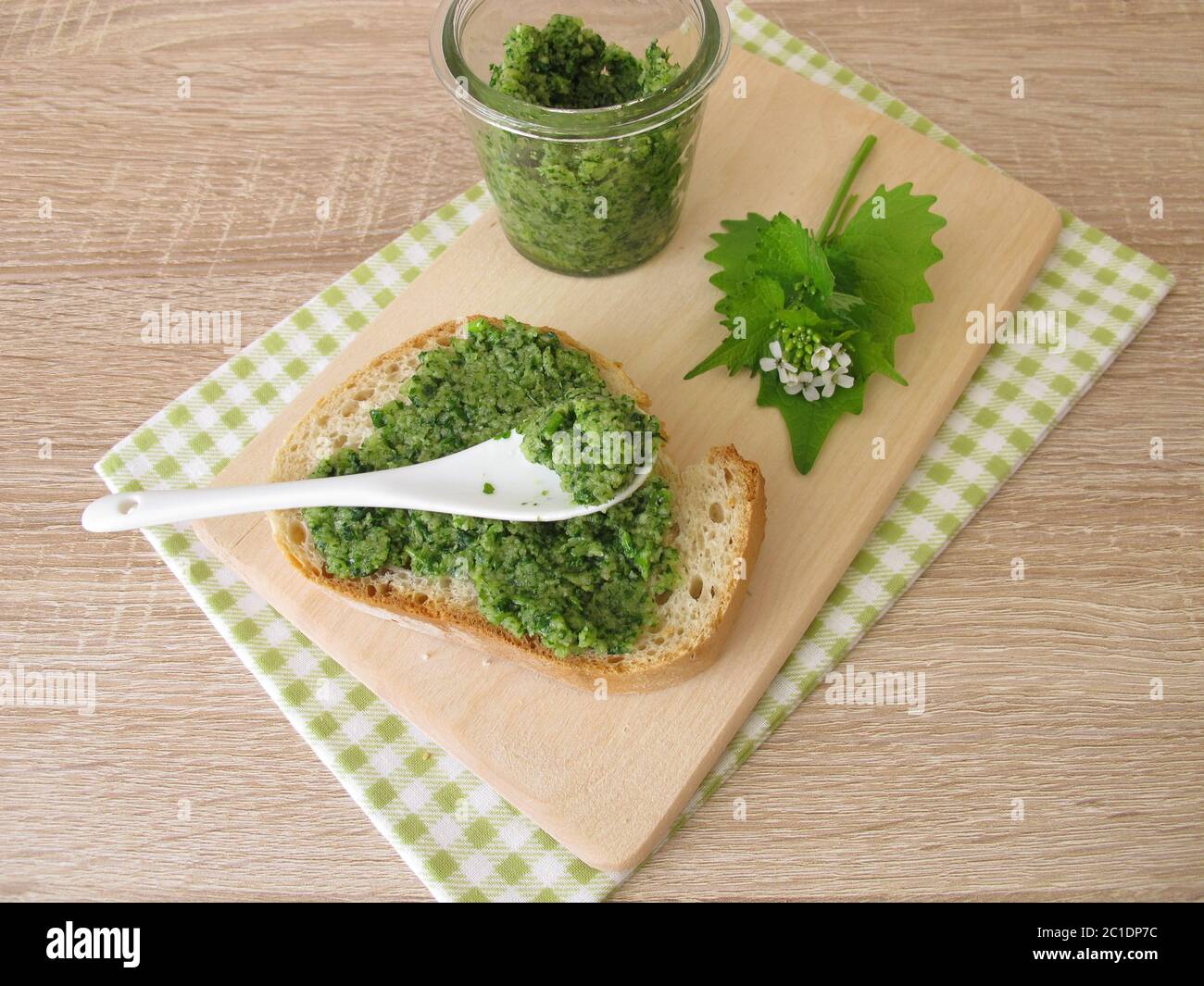 Homemade garlic mustard pesto on baguette Stock Photo