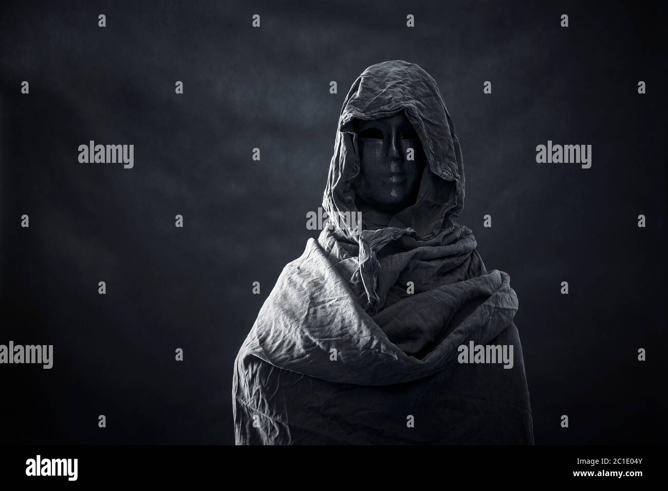 Figure in black hood hi-res stock photography and images - Page 2 - Alamy