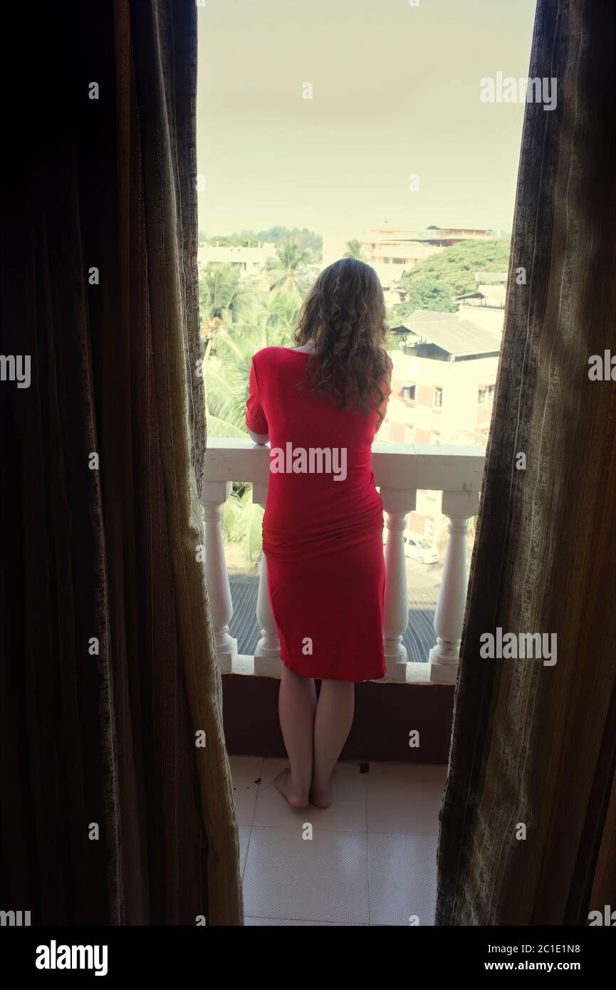 Indian woman standing in balcony hi-res stock photography and images ...