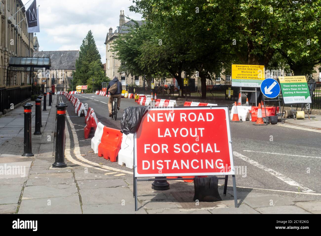 Non essential shops reopen in Bath. Pavements widened in the City with street barriiers in place so social distancing measures can be met. England, UK Stock Photo