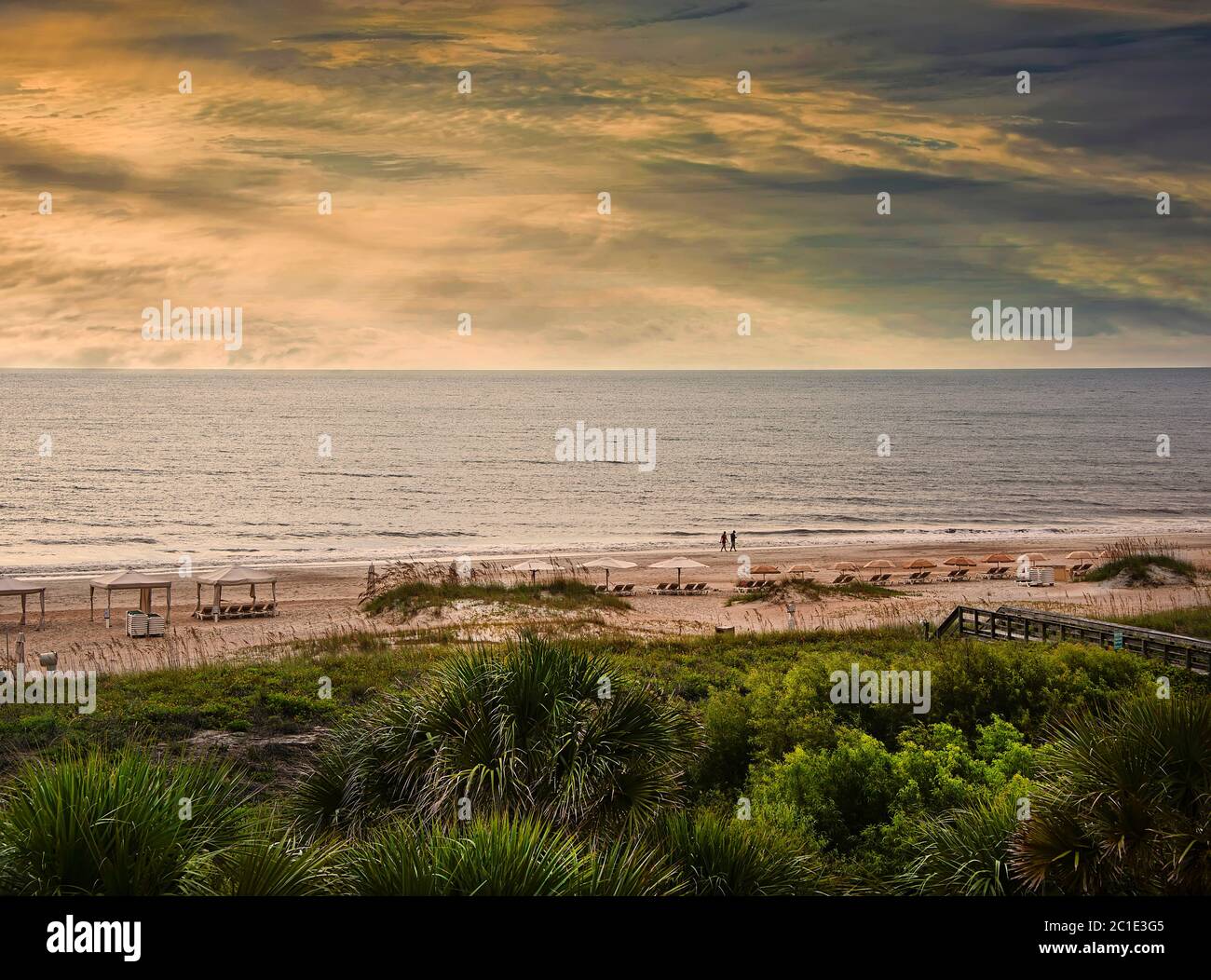 Sun setting on the horizon on Amelia Island Beach and the Atlantic Ocean, in Amelia Island, Florida Stock Photo