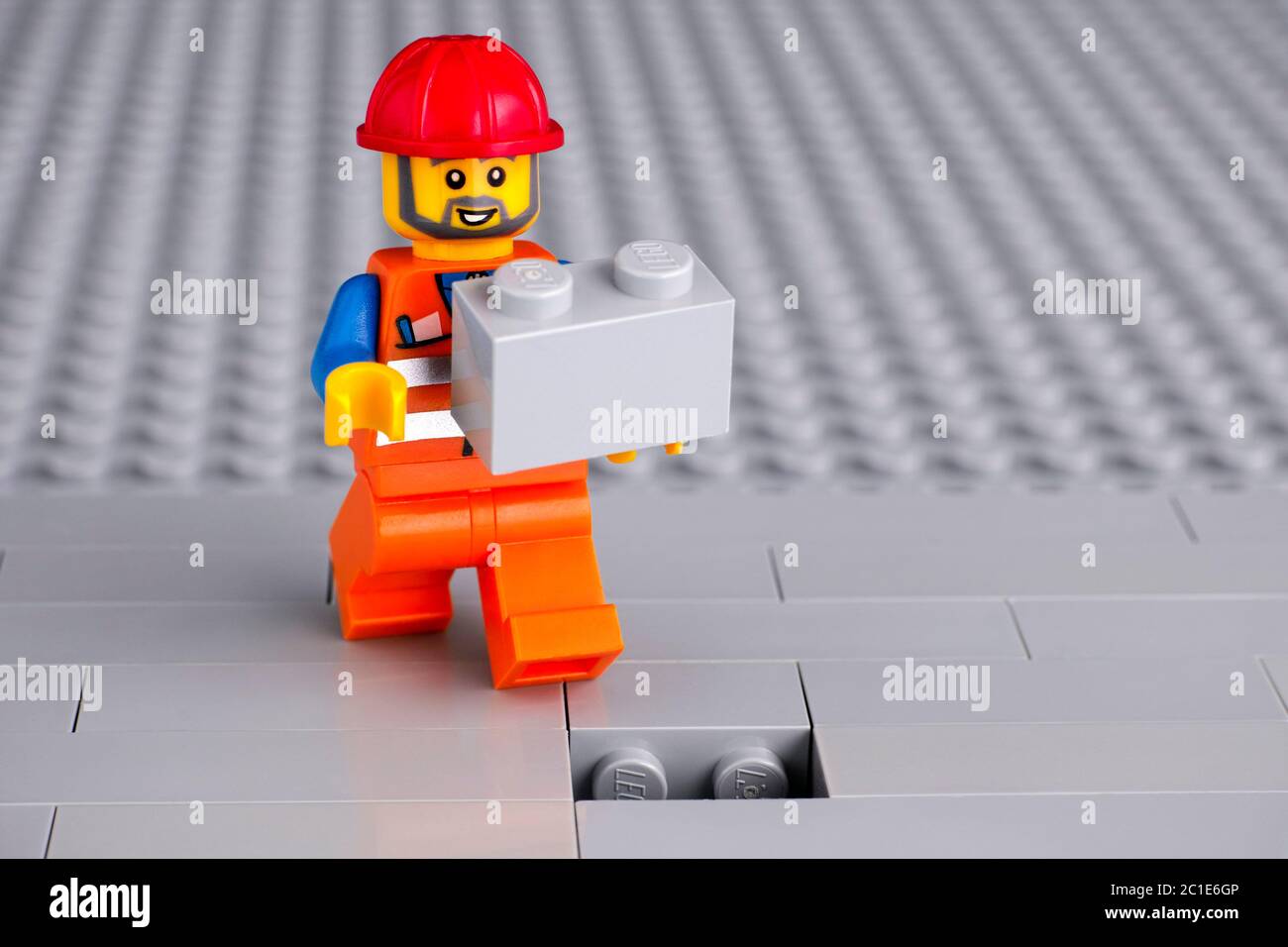 Tambov, Russian Federation - June 06, 2020 Lego construction worker  minifigure with gray brick ready to finishing building wall Stock Photo -  Alamy