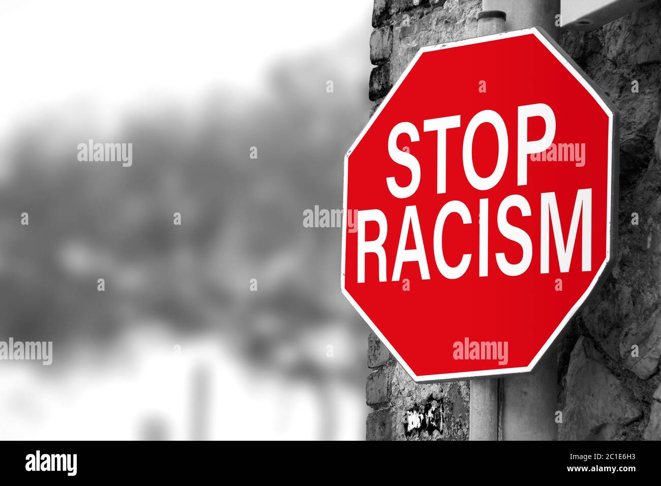 Traffic sign with 'Stop racism' message. Selective focus. Black Lives Matter concept. Stock Photo