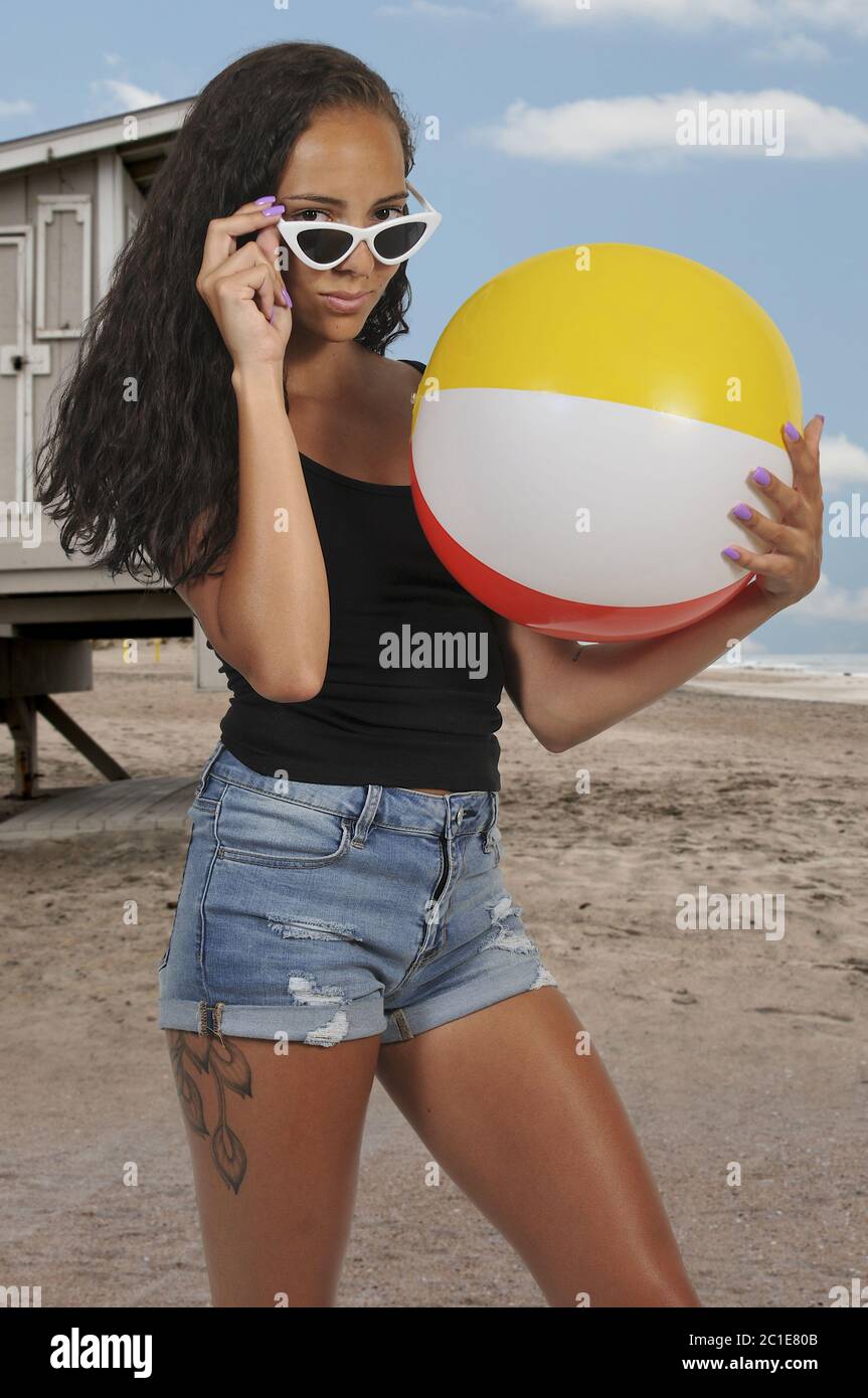 Woman Holding Beach ball Stock Photo