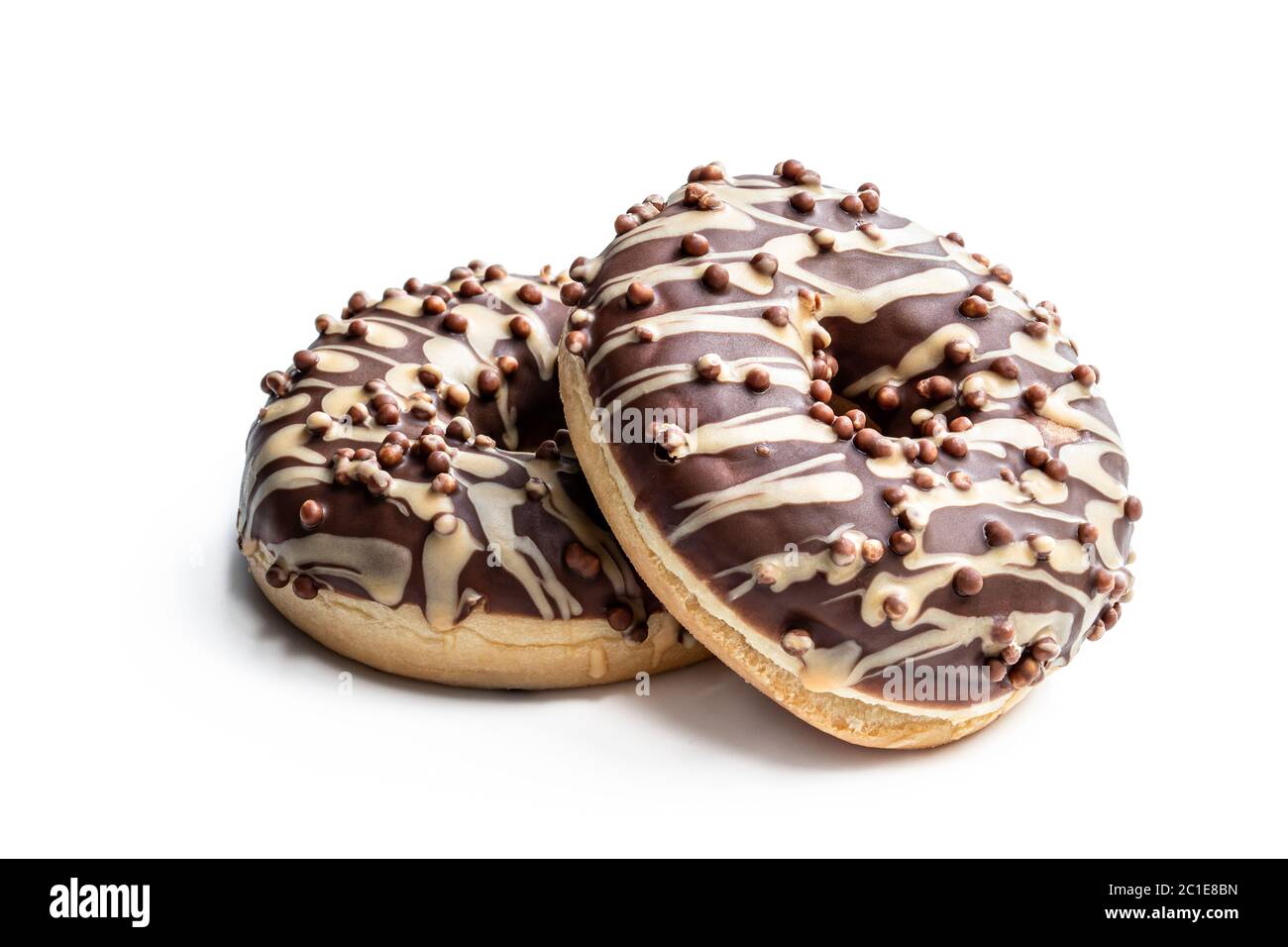 Doughnuts covered with chocolate and caramel icing isolated on white