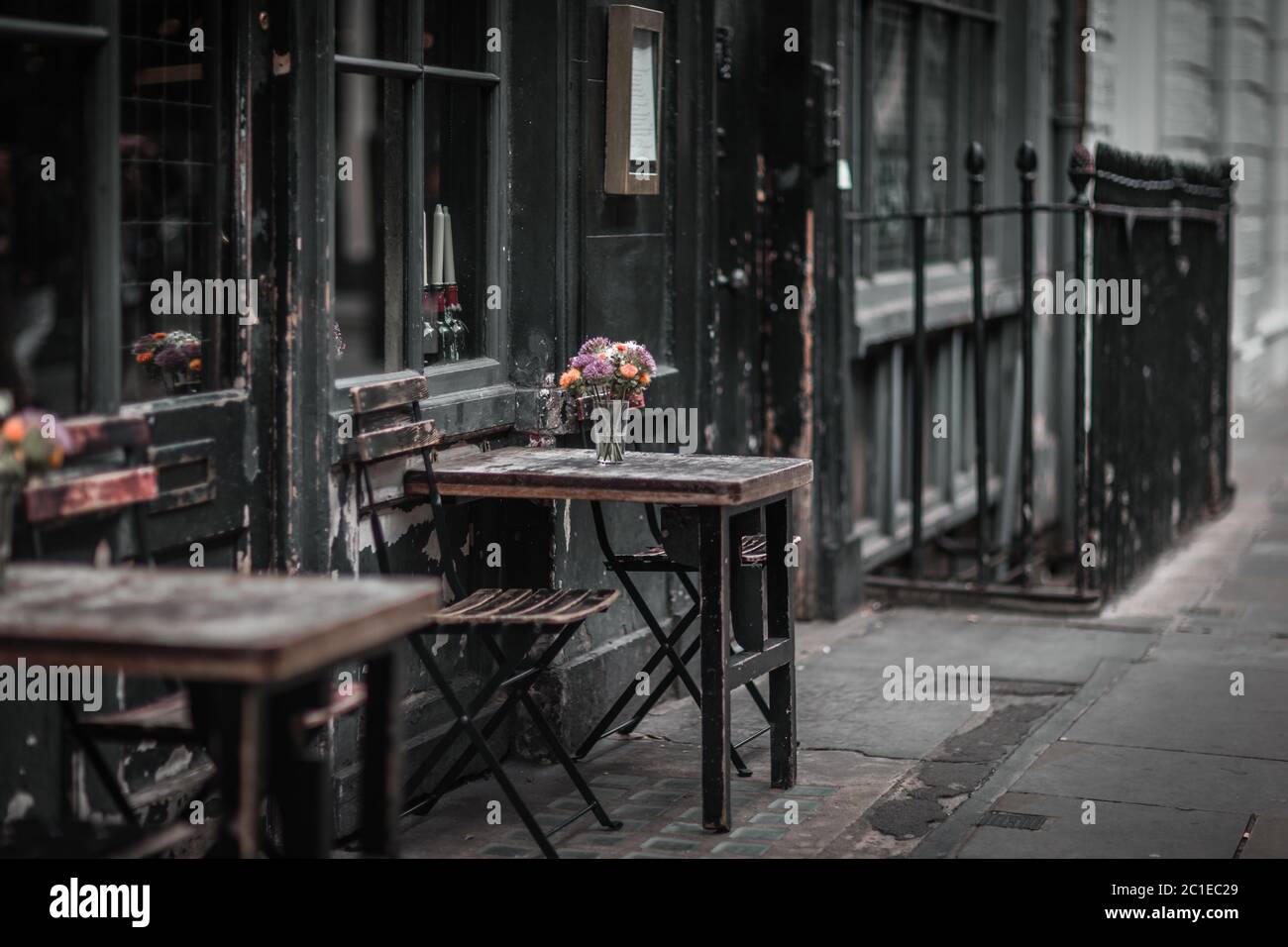 Empty tables outside a pub in London. Stock Photo