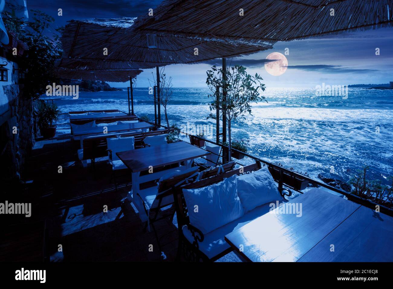 terrace of a restaurant on the sea at night. beautiful view in to the