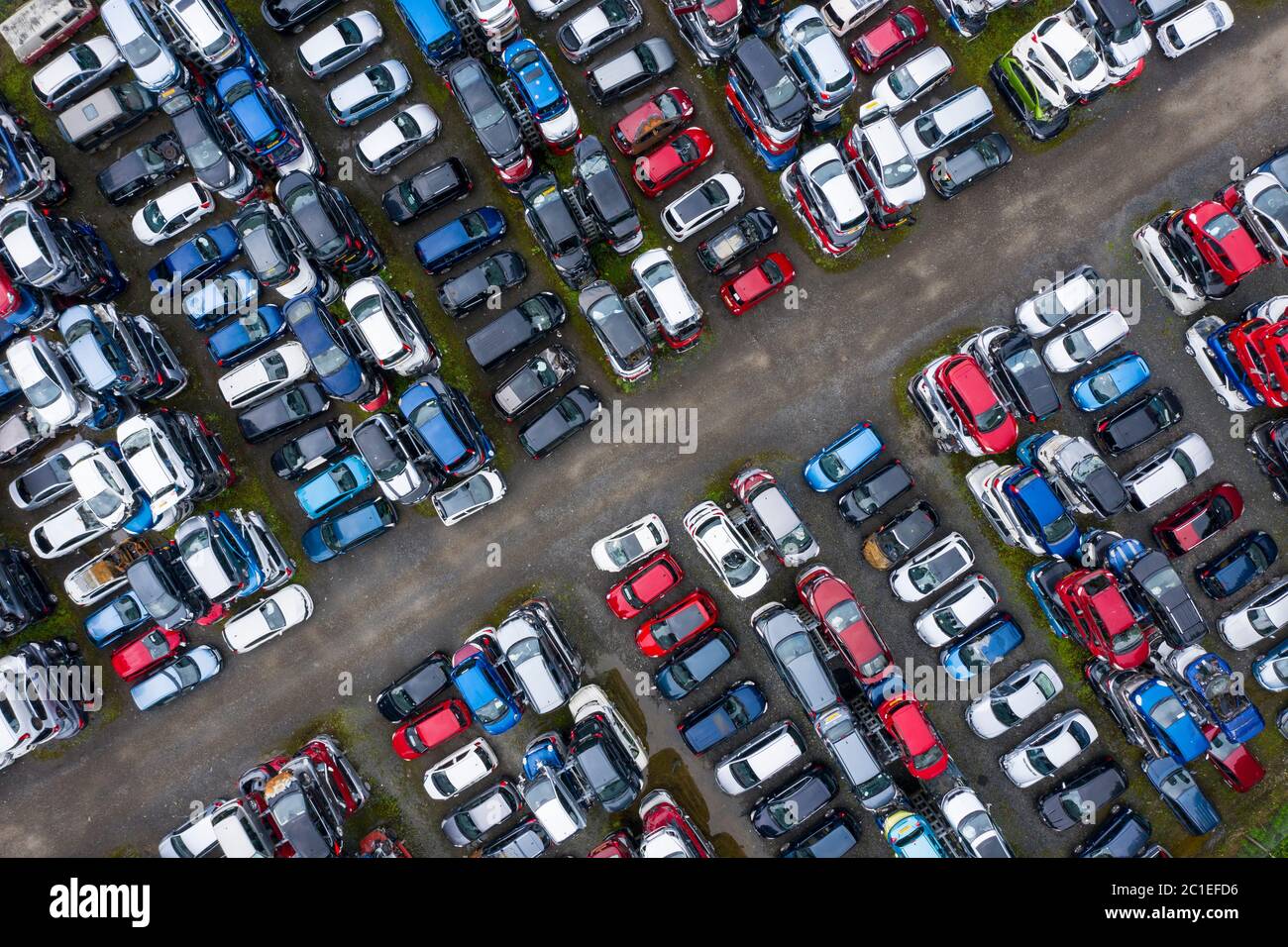 Aerial view of many cars stored in a car breaking yard or scrap yard in Scotland, UK. Stock Photo