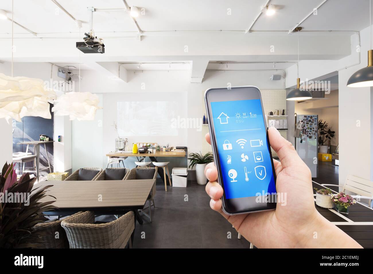 mobile phone with smart home app in modern living room Stock Photo - Alamy