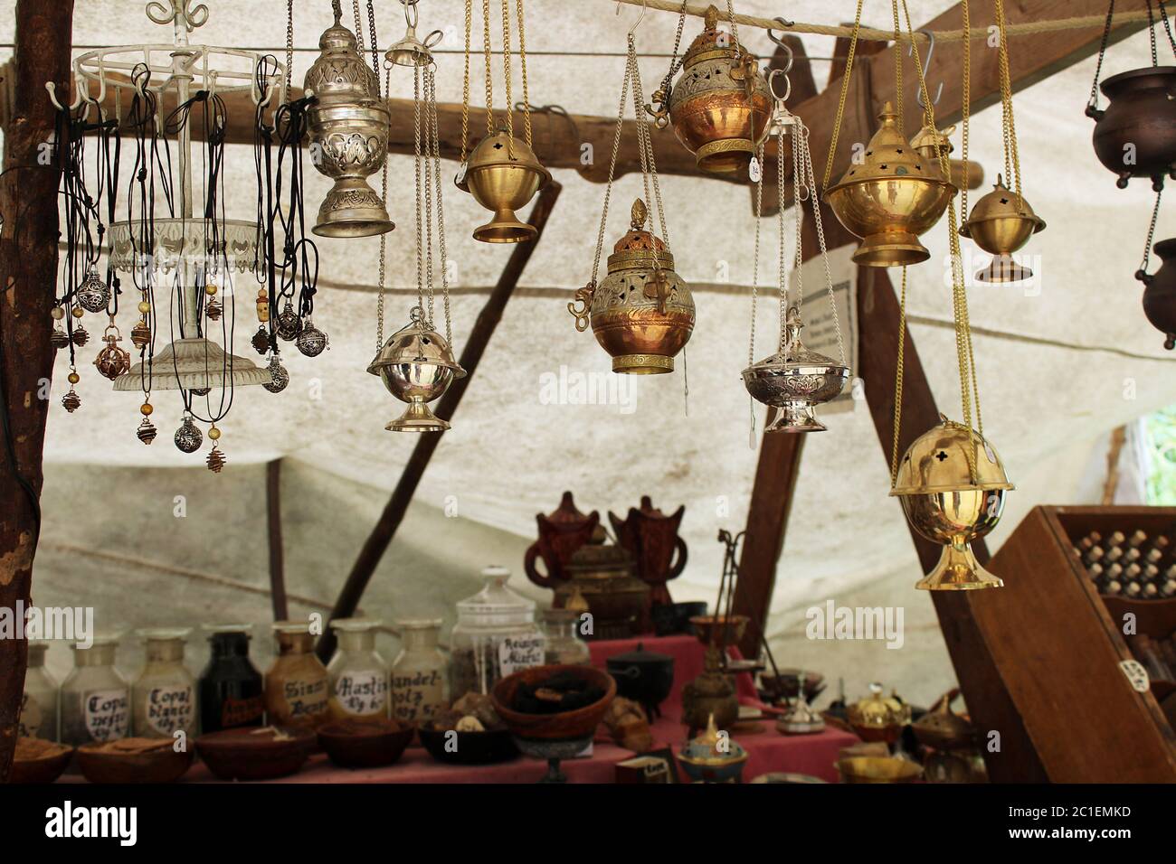 Incense burner lamps hanging at stall at medieval fair in Bueckeburg, Germany. Aromatherapy, meditation concept Stock Photo