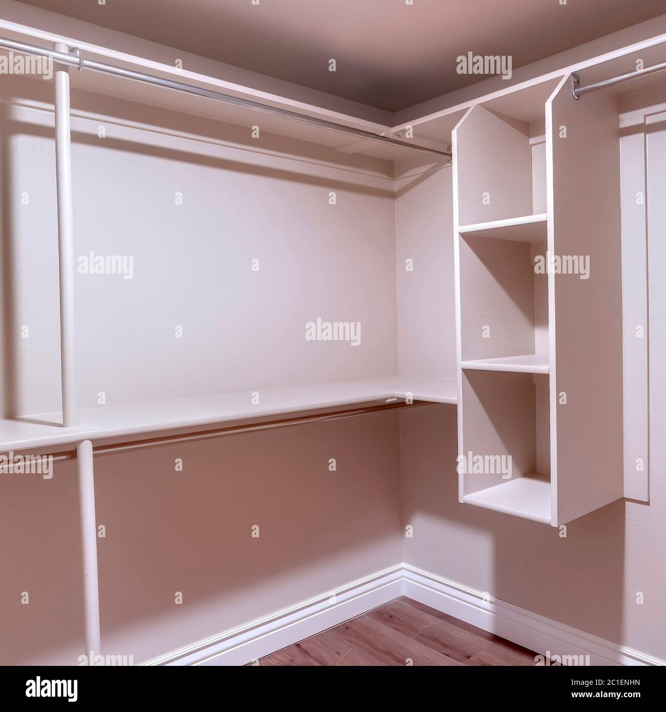 Square Spacious walk in closet of new home with metal rods shelves and ...
