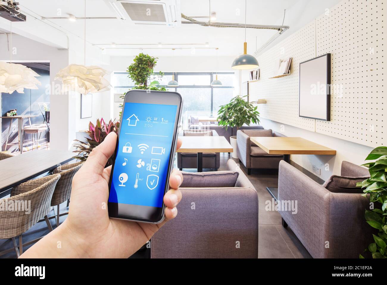 mobile phone with smart home app in modern living room Stock Photo