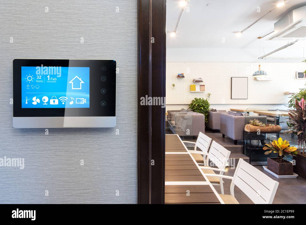 smart home app in control panel in modern restaurant Stock Photo
