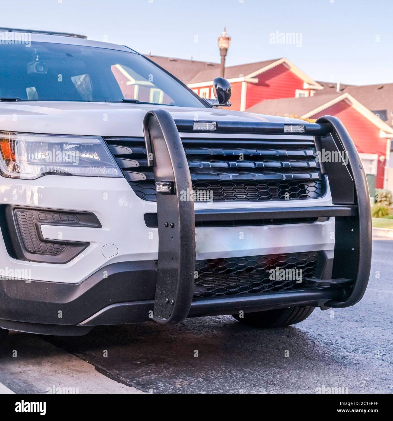 Square White SUV or all terrain vehicle with bull bar Stock Photo
