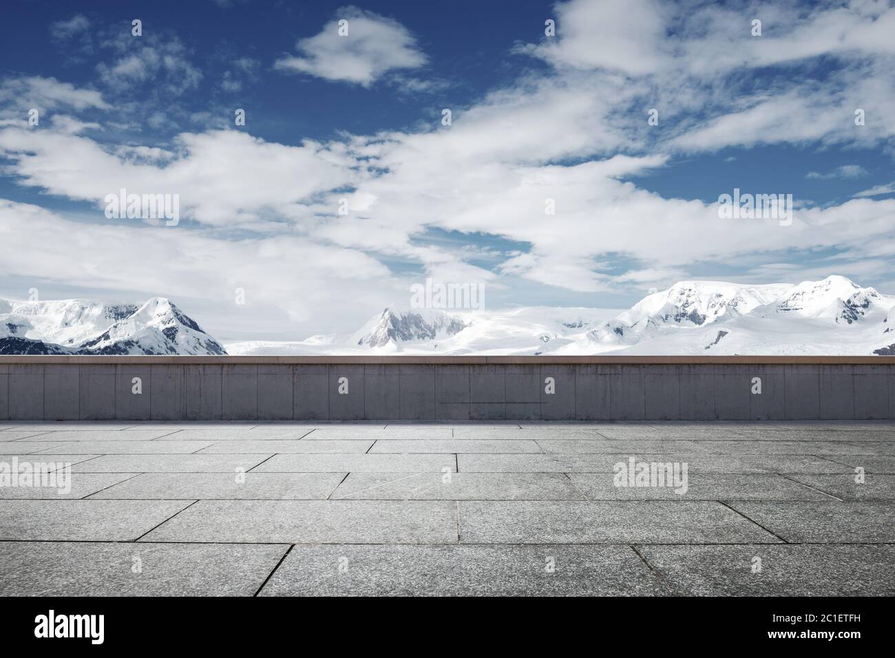 empty brick ground with sonw mountain as background Stock Photo