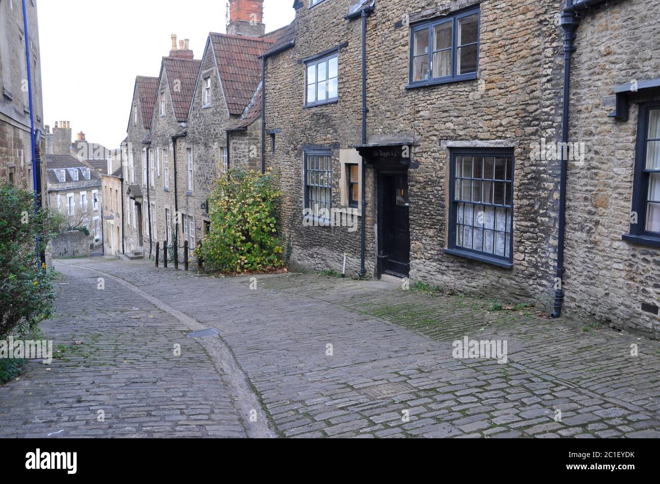 Gentle street, Frome.The steep cobbled street was the main road through the town.The Wagon and Horses Inn now a private dwelling.The street is used in Stock Photo