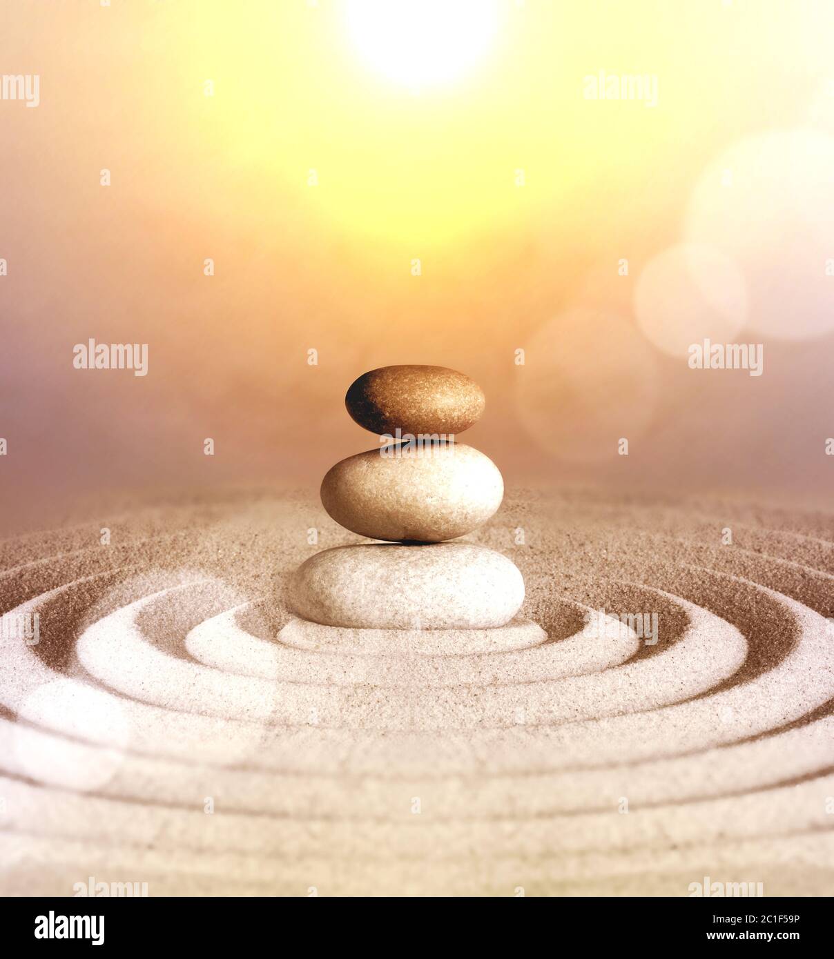 Japanese zen garden meditation stone concentration and relaxation sand and rock for harmony and balance. Stock Photo