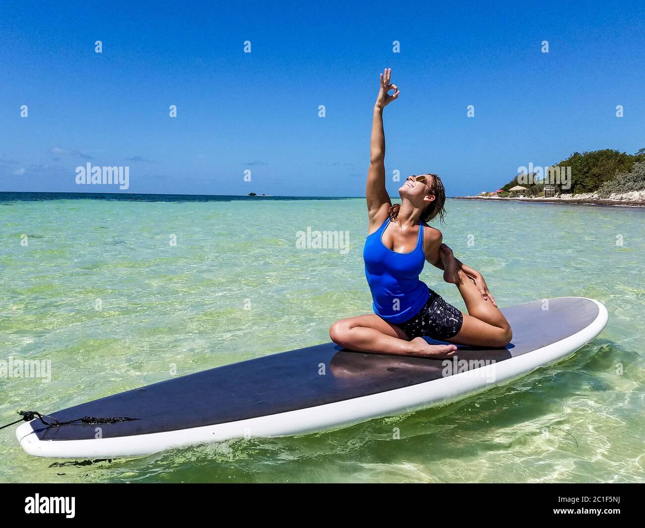 Yoga On A Stand Up Paddle Board Taught At Bahia Honda State Park Along