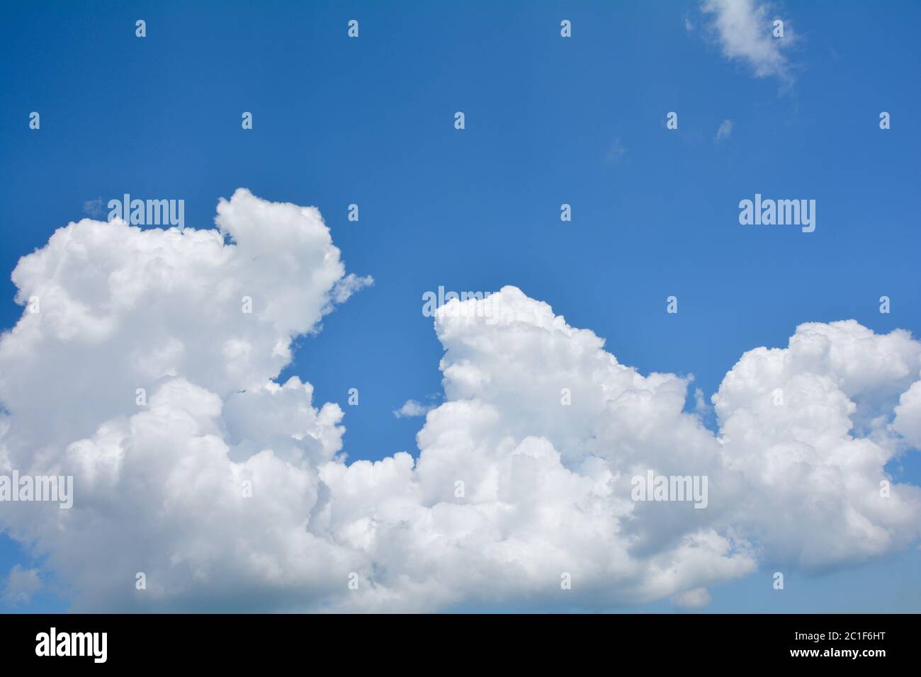Blue sky background with white clouds and copy space Stock Photo - Alamy
