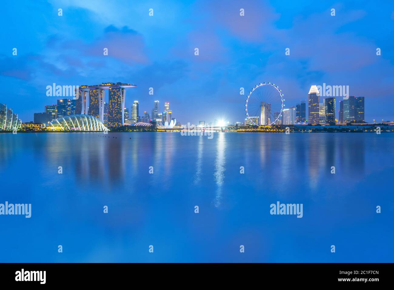 Singapore city skyline with Marina Bay at night Stock Photo - Alamy