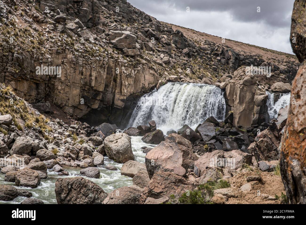 beautiful waterfall on the rocks, creek and no people, clouds Stock Photo