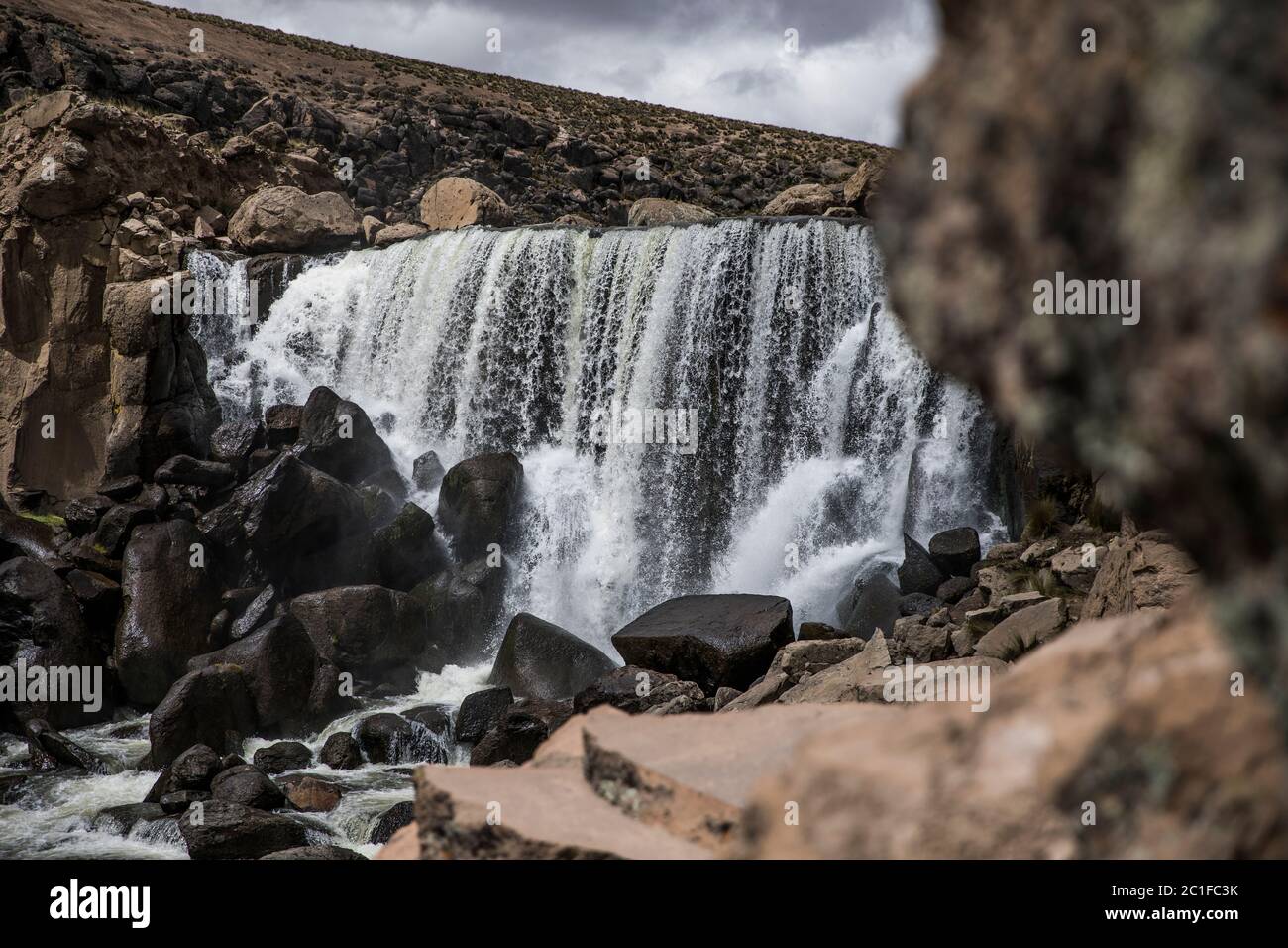 beautiful waterfall on the rocks, creek and no people, clouds Stock Photo