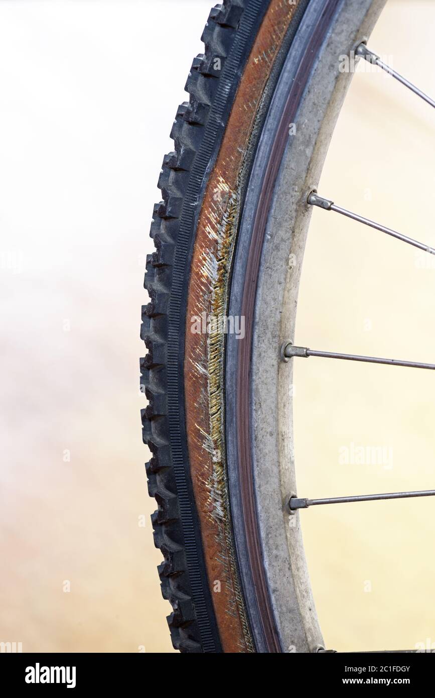 damaged old bicycle tire with damaged sidewall Stock Photo