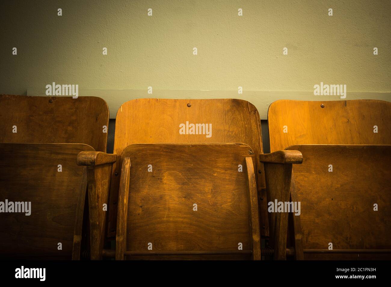 Old wooden vintage chair Seat cinema or school antique Stock Photo
