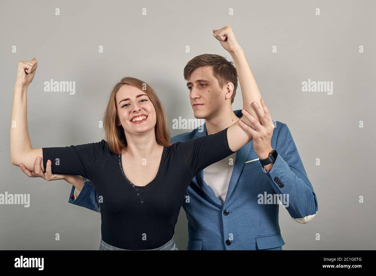 Man Shows Muscles Friends Hi res Stock Photography And Images Alamy