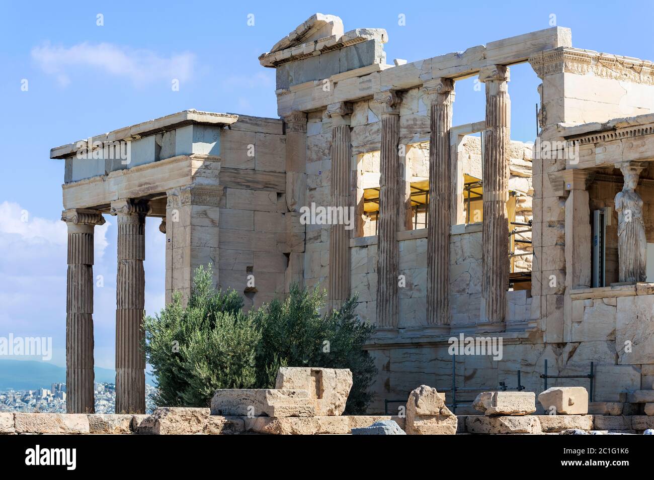 The caryatid statue and the columns of Erechtheion temple on Acropolis Hill, Athens Greece. Stock Photo