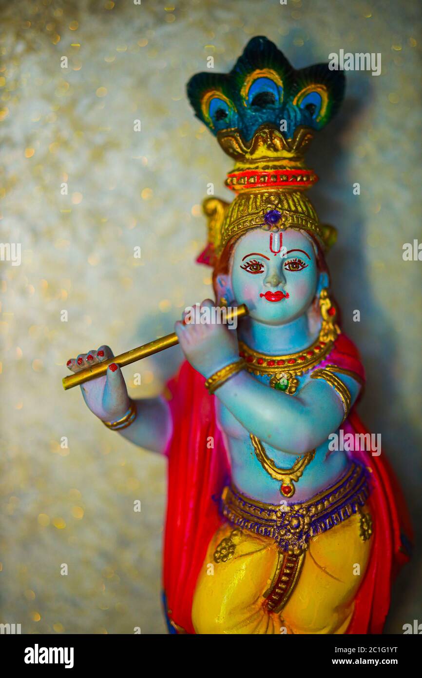 Colorful figure of the Hindu God Krishna playing the flute. Lord