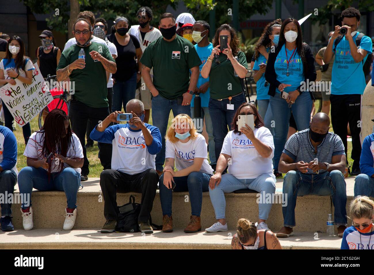 Oakland, CA - June 10, 2020: Protestors participating in  the George Floyd Black Lives Matter protest in Oakland, Rally at City Hall on 14th and Broad Stock Photo