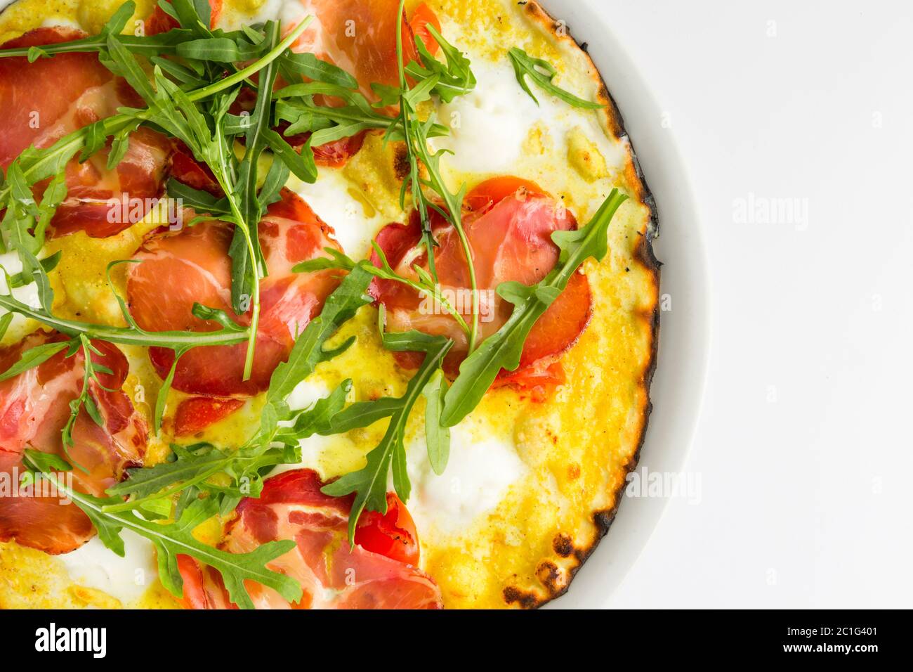 Pizza with capocollo, rocket, sauce and stracciatella Stock Photo Alamy