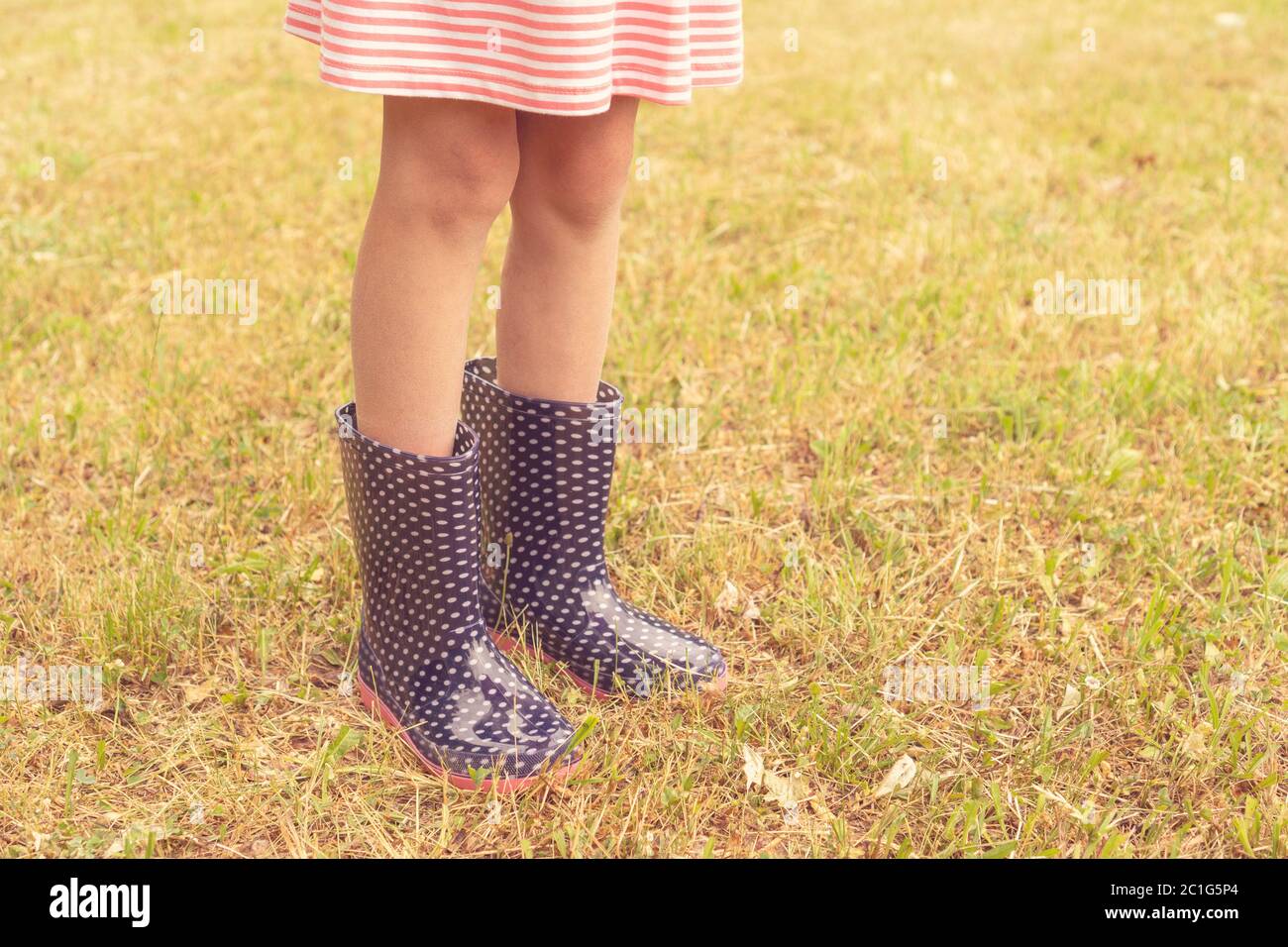 Girl wearing rain boots Stock Photo Alamy
