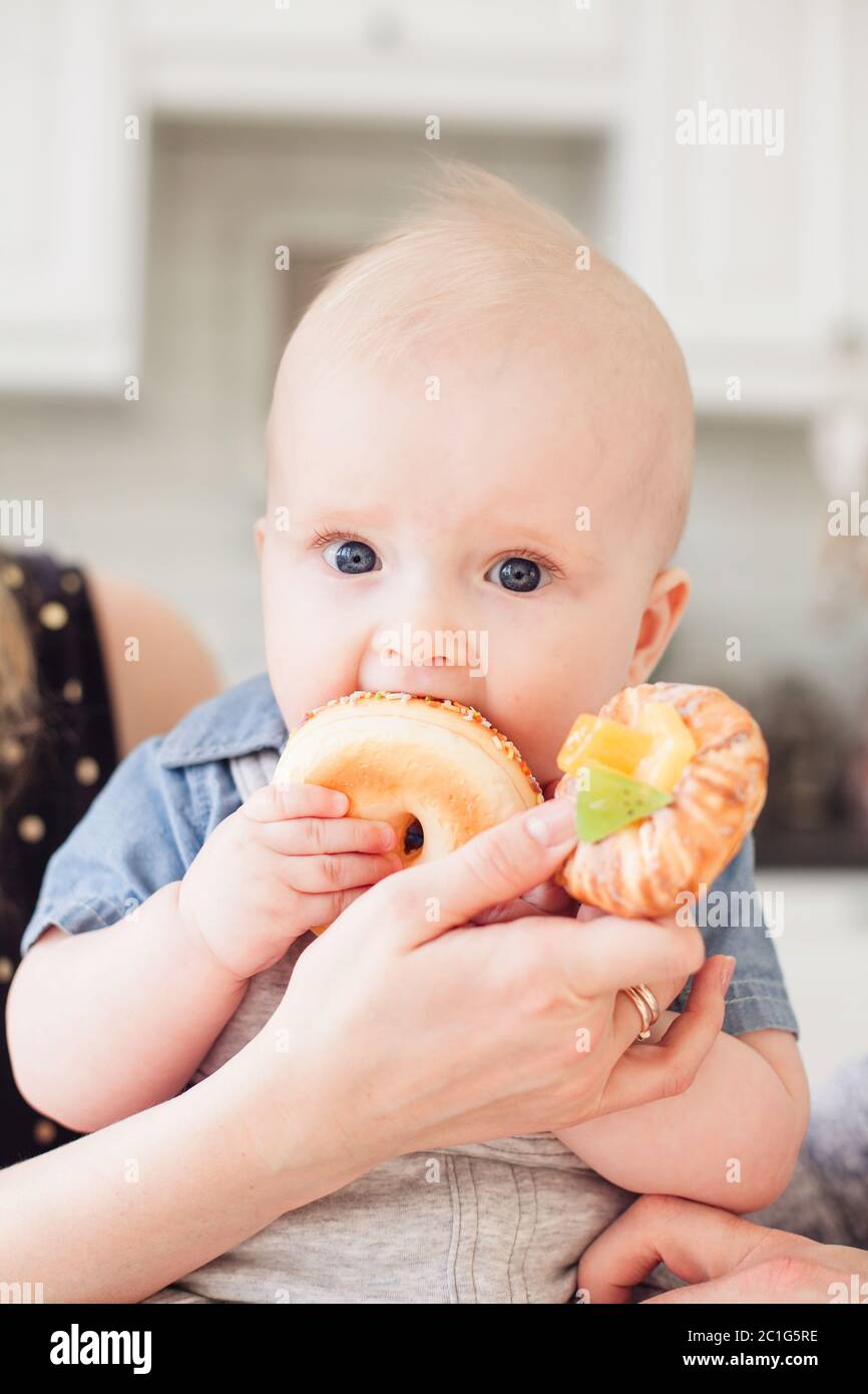 Little boy eating donut hires stock photography and images Alamy