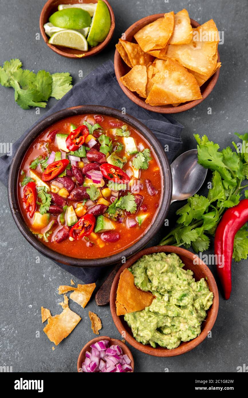 Mexican Food Concept Background With Chile Black Bean Soup Guacamole And Nachos Totopos Top View Stock Photo Alamy