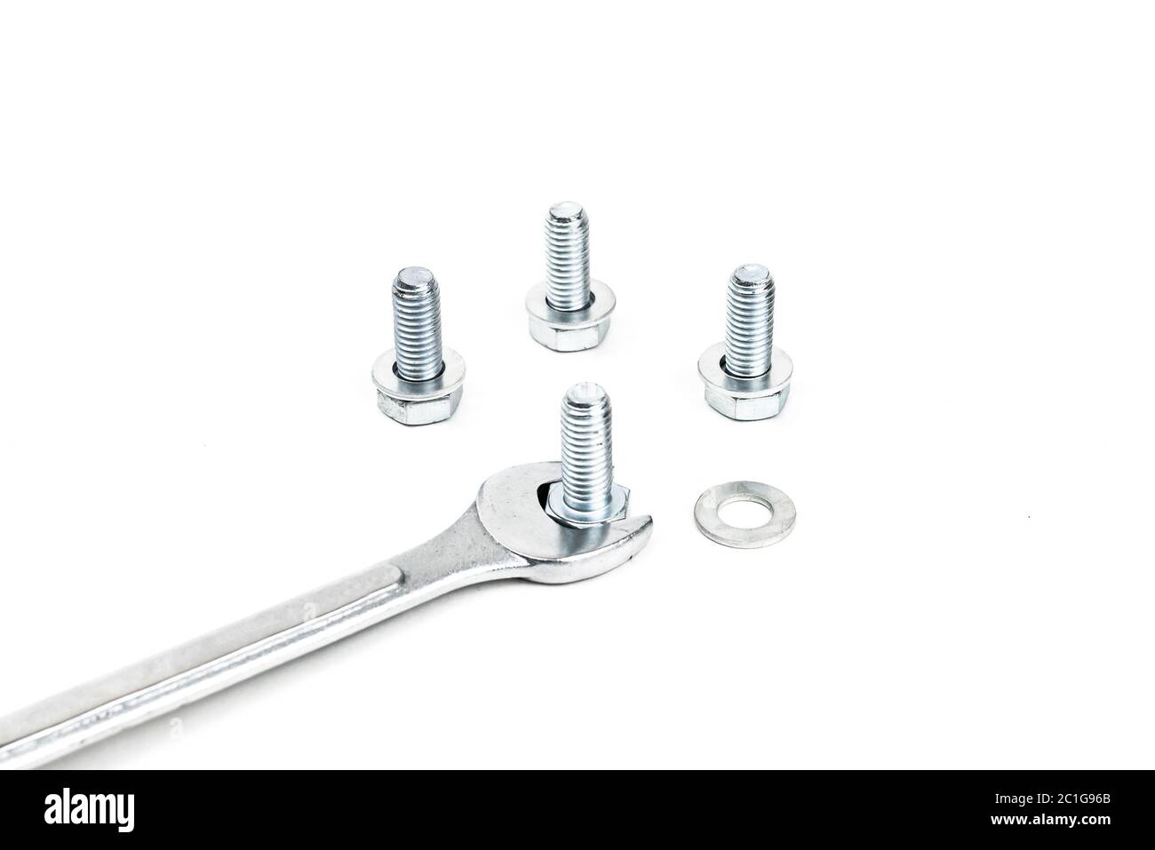 Spanners and screw nuts isolated on white background. Selective focus. Stock Photo