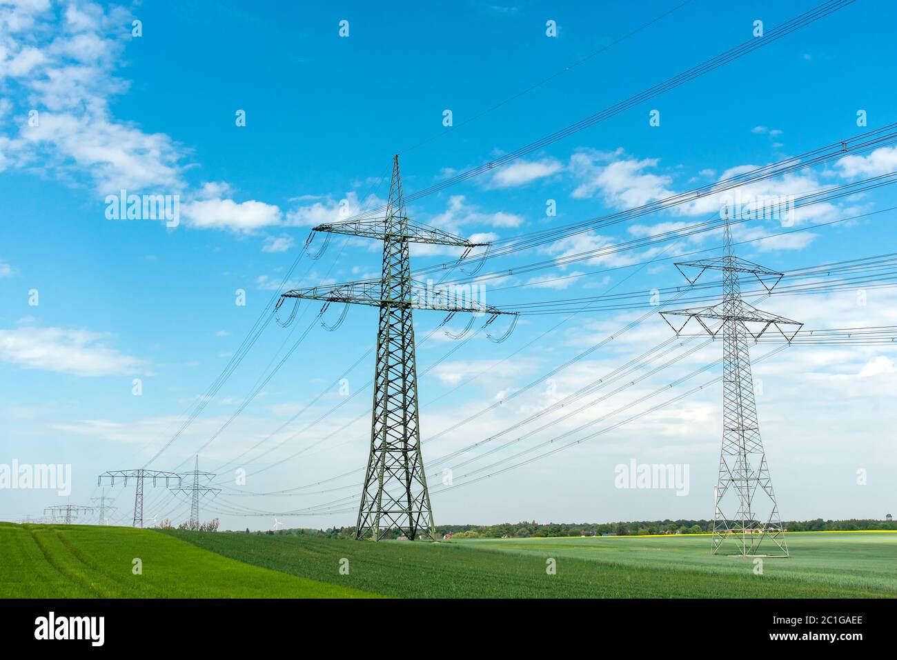 High-voltage lines on a sunny day seen in Germany Stock Photo