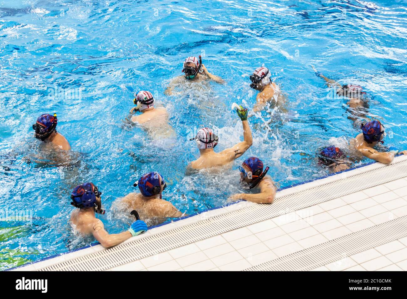 Canadian athletes celebrating after a goal at a game of underwater