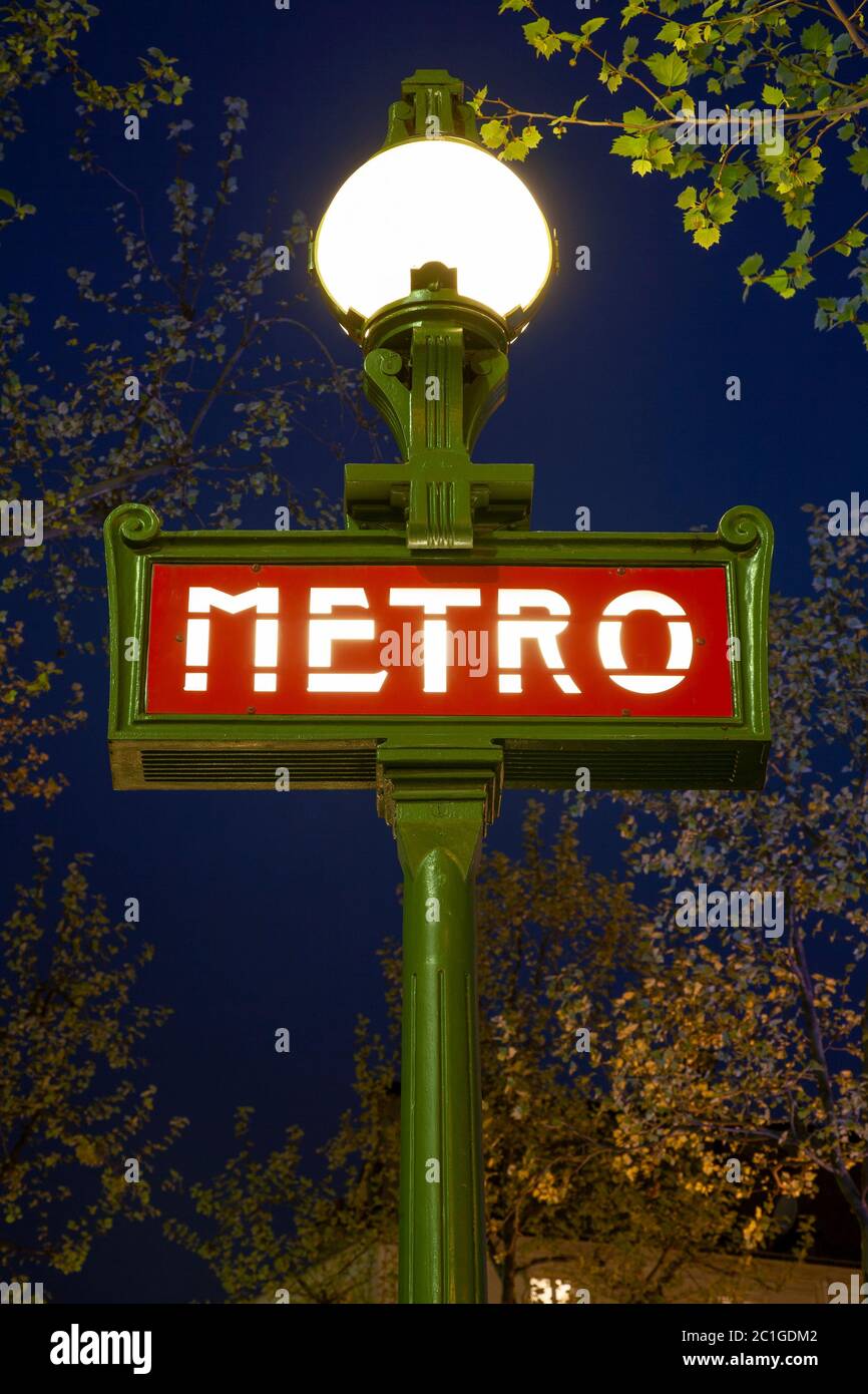 Metro sign at night, Paris, France Stock Photo